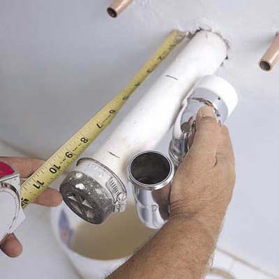 measuring pipe while installing a sink