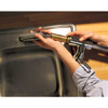 Positioning the new faucet.