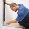 attaching a hinge-side jamb of a shower door