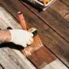 stain the deck with long, even strokes