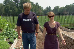 Roger Cook and Bedford homeowner touring vegetable gardens on episode 3107 of This Old House