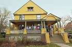 the crew and everyone else involved in the Belmont Victorian house project on the front porch