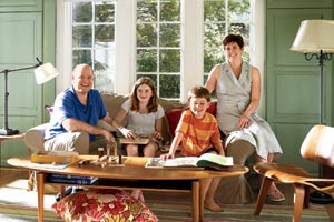 the Coyne family sits in their remodeled living room