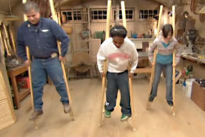 Tom Silva and kids on stilts