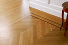 a newly installed herringbone floor
