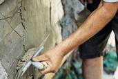 using a finishing trowel on second coat of stucco